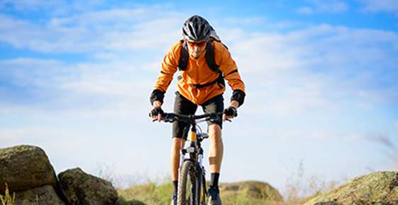 Image of mountain biker wearing protective glasses. 