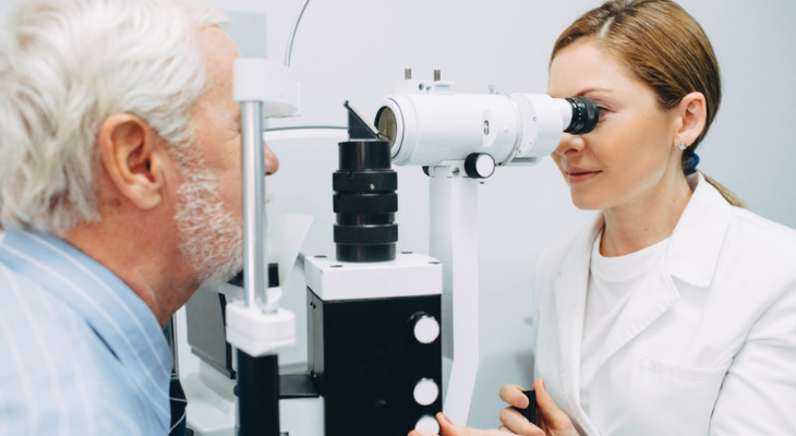 Older man at optometrist having eyes examined